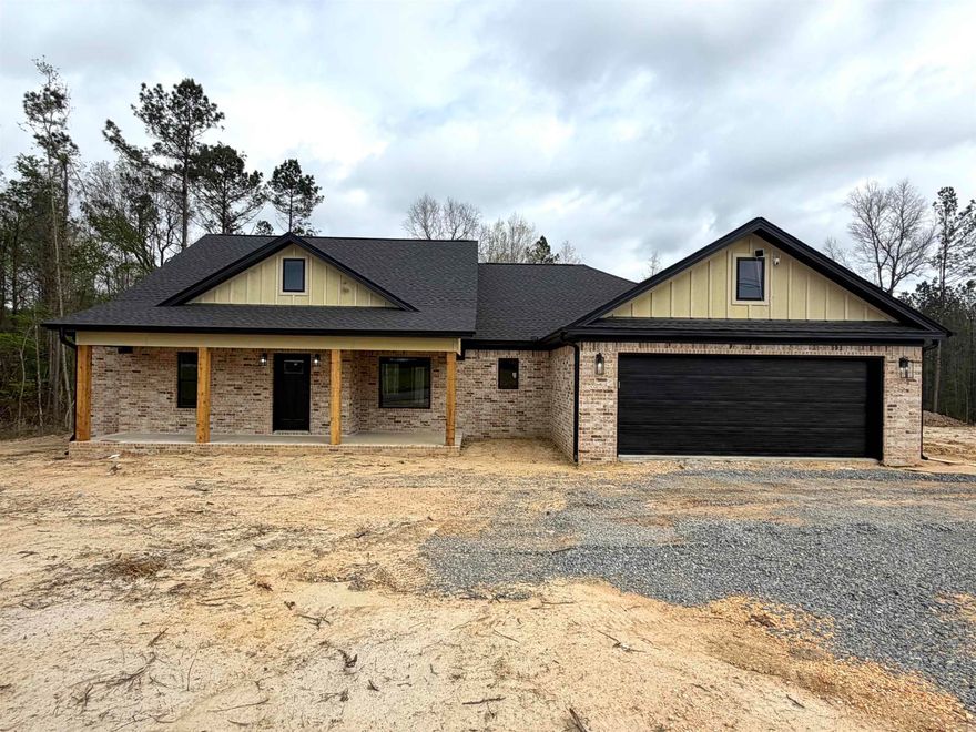Discover the perfect blend of comfort and privacy with this fully bricked beautiful 4 bedroom, 2 bathroom home situated on 2.30 acres. This home features an open, split floor plan that offers both functionality and style for everyday living. The heart of the home includes a well-appointed kitchen with stainless steel appliances, a gas stove, and a large walk-in pantry- perfect for storage and entertaining. You'll also find a gas fireplace, spacious primary suite complete with his and hers vanities, a large walk-in closet, soaking tub, and walk-in tile shower. When you step outside to the expansive back patio, you'll find peaceful wooded views- ideal for relaxing or hosting family and friends. This property offers the space you want with the features you need!! Don't miss your chance to call it home!! Schedule your showing today!!
