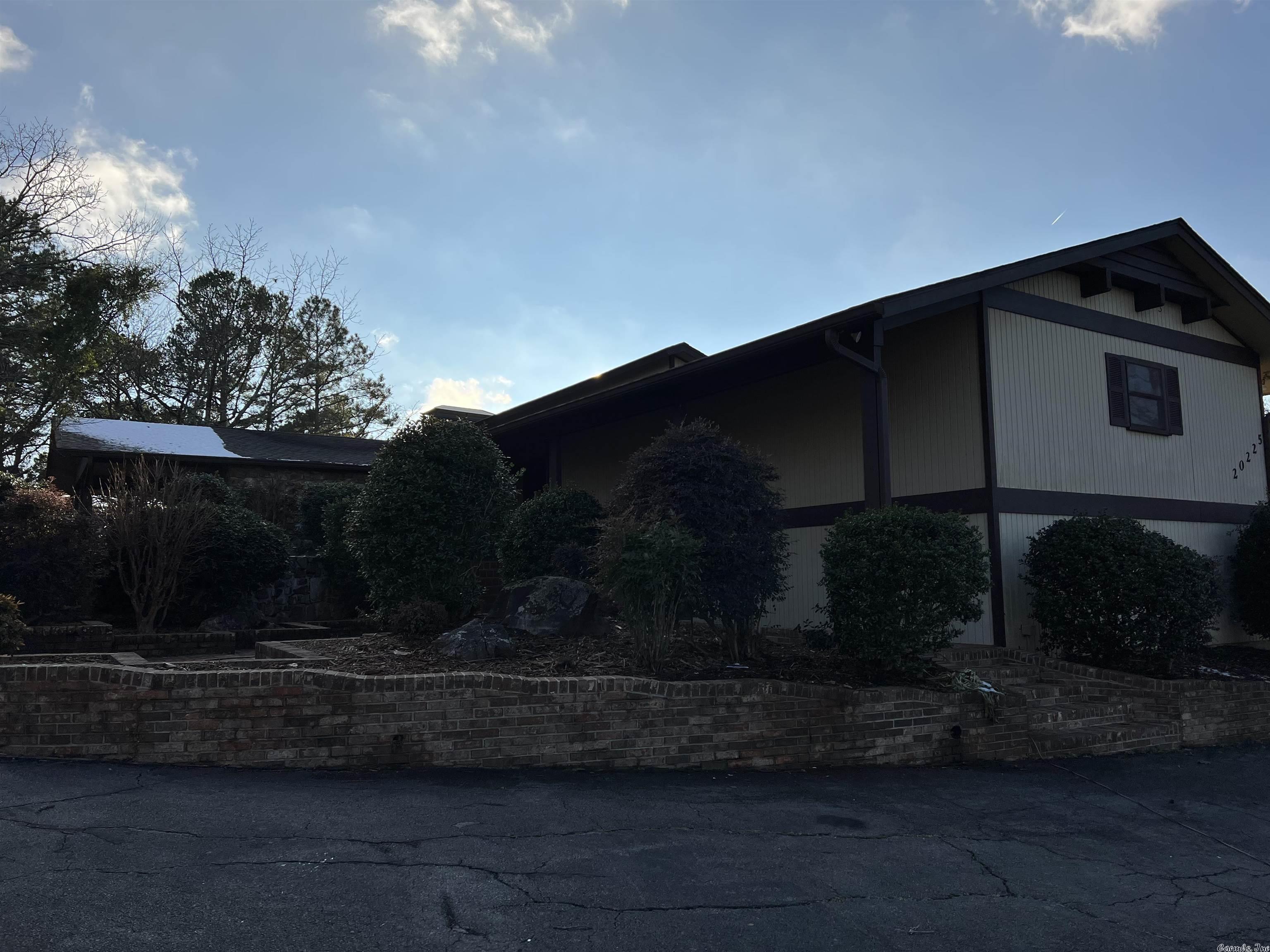 Tons of space inside and out! Spacious home on 22 acres with a beautiful view of Pinnacle mountain,Lake Maumelle and the Arkansas River. Beautiful country setting just minutes from everything Little Rock has to offer! Lots of updates in the last few  years include Hvac, Roof, Insulation, Paint, Carpet, Tile, marble counters and much more. Home has an indoor shop, cedar closet, large walk in pantry. There's an 8 stall horse barn complete with wash and tack room on the property as well.