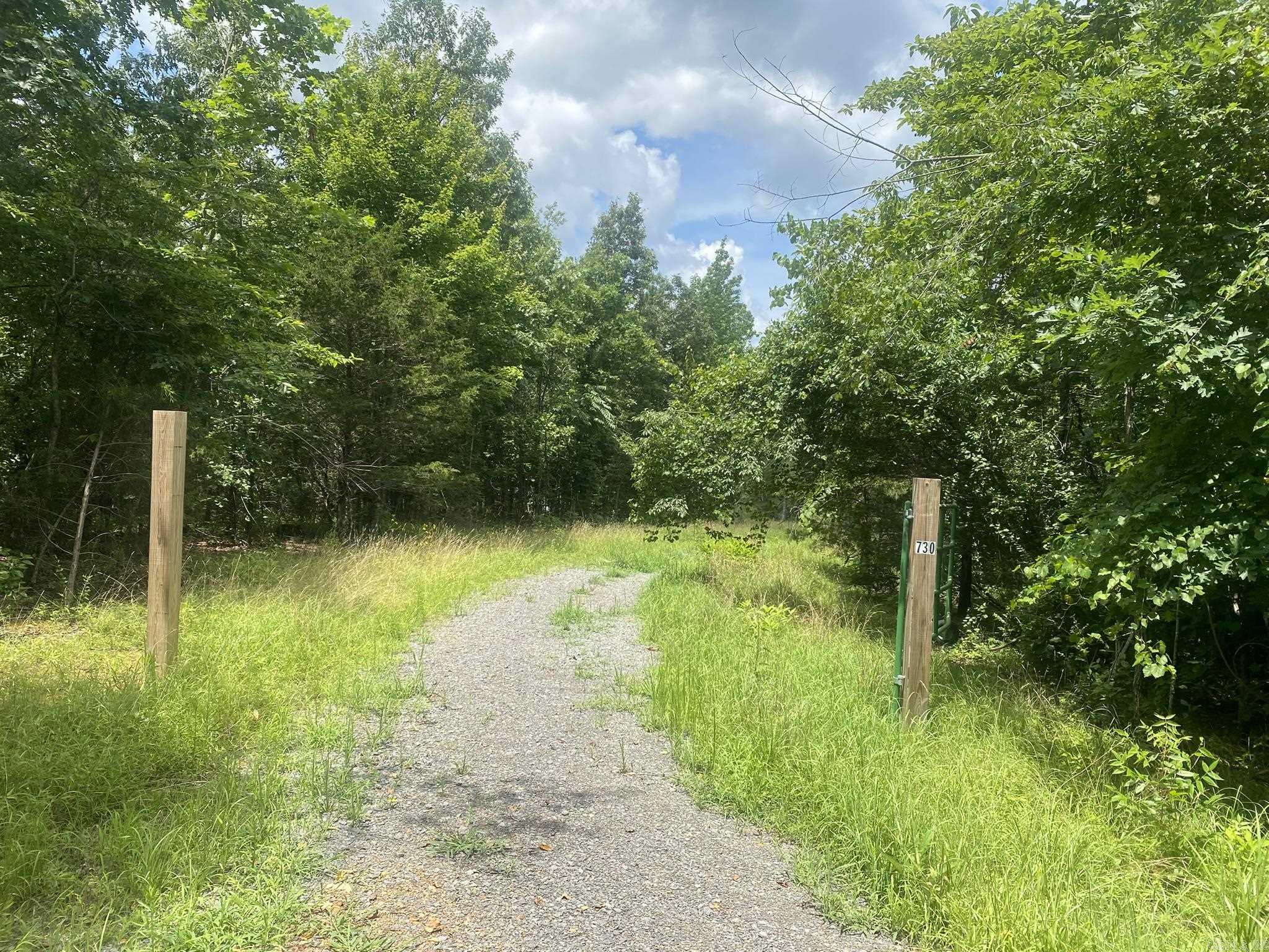 This property is a wonderful piece of property approximately 3 miles from Fairfield Bay Golf and Resort as well as Greers Ferry Lake. There are buildings and home started. Prime hunting or homestead property. All buildings are 1 1/2 years old or less and some have never been used. The green building is a chicken house and it is one year old. There is a seasonal creek at the bottom of the property. Legal easements are in process. Will update listing when it is complete. Listing: 025041