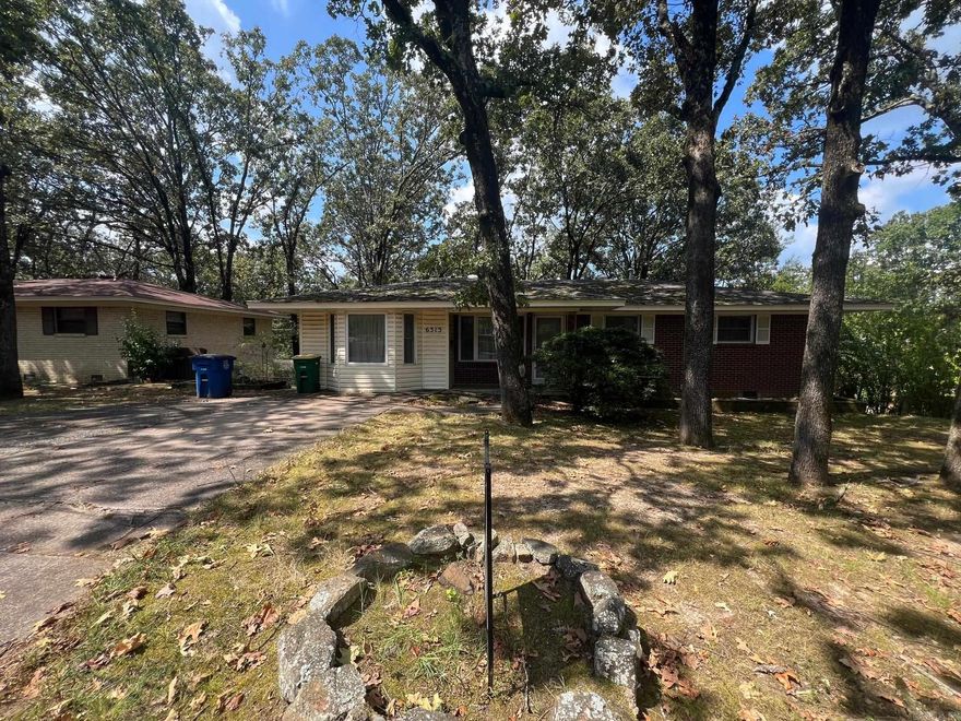 INVESTORS!!! All brick 3BR, 2.5 BA in Indian Hills. Over 2,000 SQFT. Downstairs has a separate living room, bedroom and a full bath. Beautiful original hardwoods under carpet upstairs, newer vinyl windows. So much potential here!