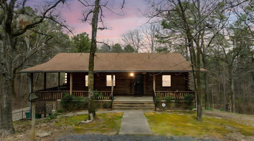 Dreaming of living the peaceful country life, but close to all West Little Rock has to offer? This is the one! Rustic Log Cabin on 1.3 Acres that has been lovingly taken care of, Huge workshop w/electric surrounded by trees for added privacy. 3 minutes to Pinnacle Mountain, short commute to Walmart & Costco! Roof 2024, new dishwasher & plumbing 2024, 2 bedrooms and 2 full bath upstairs, lower level has access to bonus room and bedroom & full bath accessible to garage could be a In Law Quarters or rental. Huge 2 car/plus extra storage or workshop (could add another bath) This one is ready for you to call it HOME!