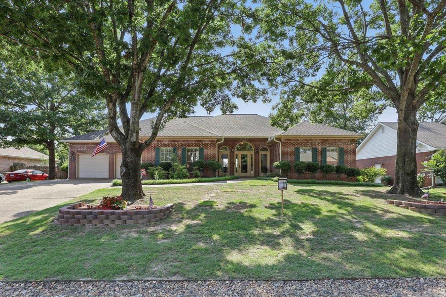 Backyard Oasis with Pool & Lake Access in Lake Hamilton School District! Step into paradise in this beautifully landscaped backyard featuring a 9-ft deep in-ground pool with a new liner, updated diving board, lush banana trees, custom night lighting, and full fencing for privacy. Enjoy private Lake Hamilton access with a boat ramp, boardwalk, and picnic area through the voluntary POA. Located in the desirable Cliffwood Subdivision, this 3-bedroom, 2.5-bath, 2,640 sq ft brick home sits on a spacious lot and is perfect for entertaining. Relax under the charming pergola on brick pavers or host gatherings on the expansive patio. A poolside half-bath, sidewalks, and a shed on a concrete slab with a new roof add convenience and charm. Inside, the spacious master suite features a new oversized shower and walk-in closet. The open kitchen connects to a breakfast nook and cozy living room with a gas fireplace. A formal dining room (or office), large pantry, and laundry room provide added function. Two guest bedrooms share a full bath. Recent upgrades include new wood flooring, roof, gutters with leaf guard, A/C, and water heater. The two-car garage includes a bonus room for a workshop!