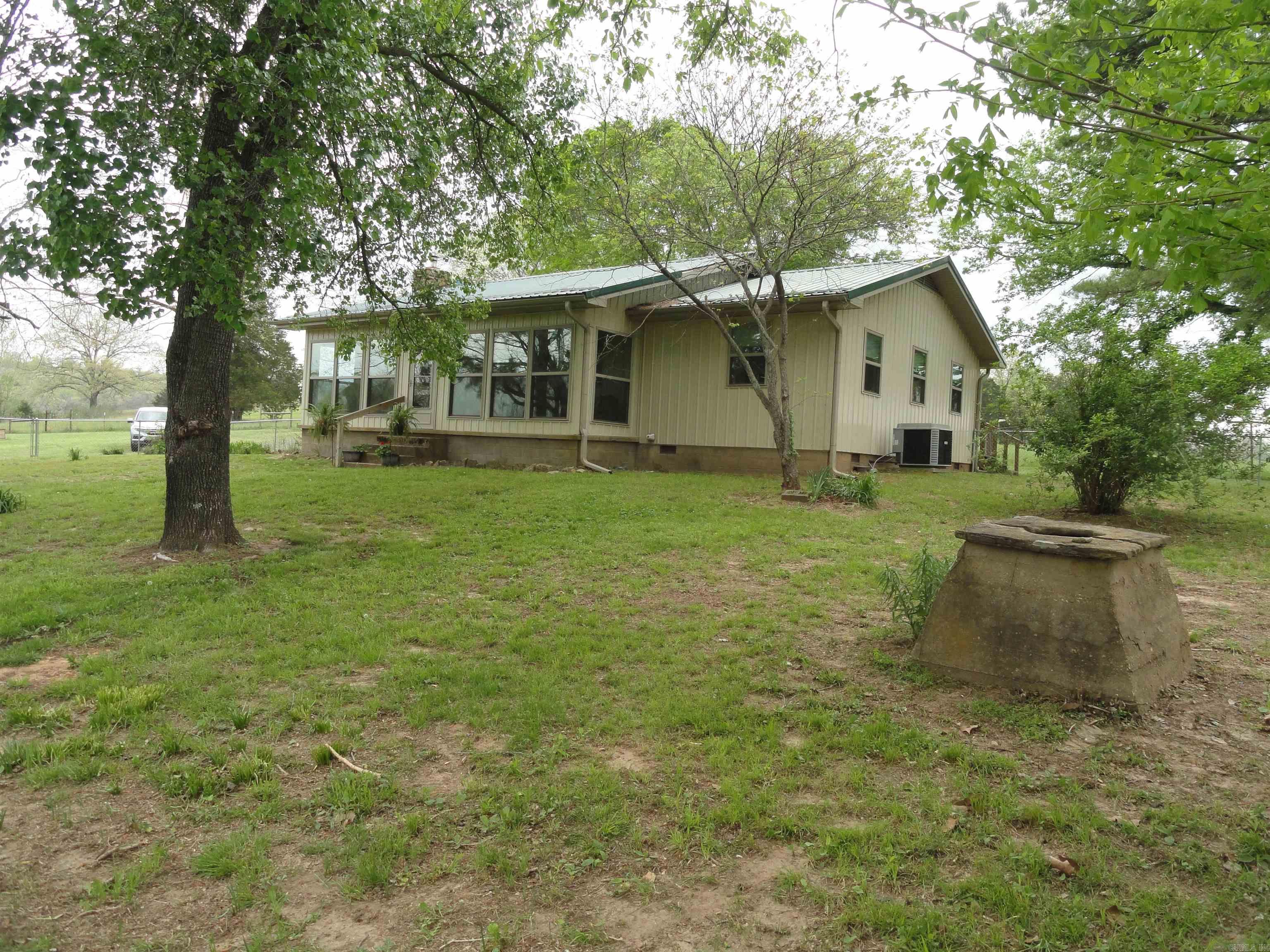 āSame as Newā Country Gem on 40 Lush Acres ā Fully Remodeled 2 Bed, 2 Bath Home + Shop, Carports, & Stocked Pond! Looking for peace, privacy & a move-in ready home that has it all? This beautiful 1,232 sq ft home was completely remodeled from the studs out in 2019 ā literally everything is new: New roof, exterior, laminate flooring, electrical, plumbing, sheetrock, lighting, heat pump & ductwork, gorgeous granite countertops, appliances, large master suite, storm cellar, sunroom, 8x44 deck & fireplace insert for cozy wood heat sitting on 40 acres of the most beautiful, lush pastureland aroundāperfect for cattle, horses , hay production. The land is currently used for hay fields and includes a stocked pond with catfish/bluegill making it your own personal fishing hole right out back! Property features also include: Detached wooden carport enclosed on 3 sides, Portable metal carport, large workshop with sliding door (use as a garage or shop space), open-air equipment storage area. This is more than just a house, this is your dream country homestead. Everythingās been done for you, so you can just move in and start living the good life. Donāt miss this one ā itās the total package!