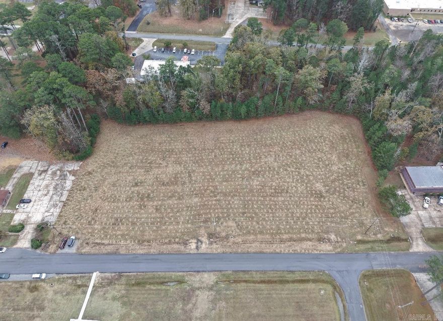 Two vacant commercial lots, including an additional 0.59-acre strip of land located directly behind them. This property offers an ideal location for a medical facility or professional office, with close proximity to the hospital and surrounding medical offices.