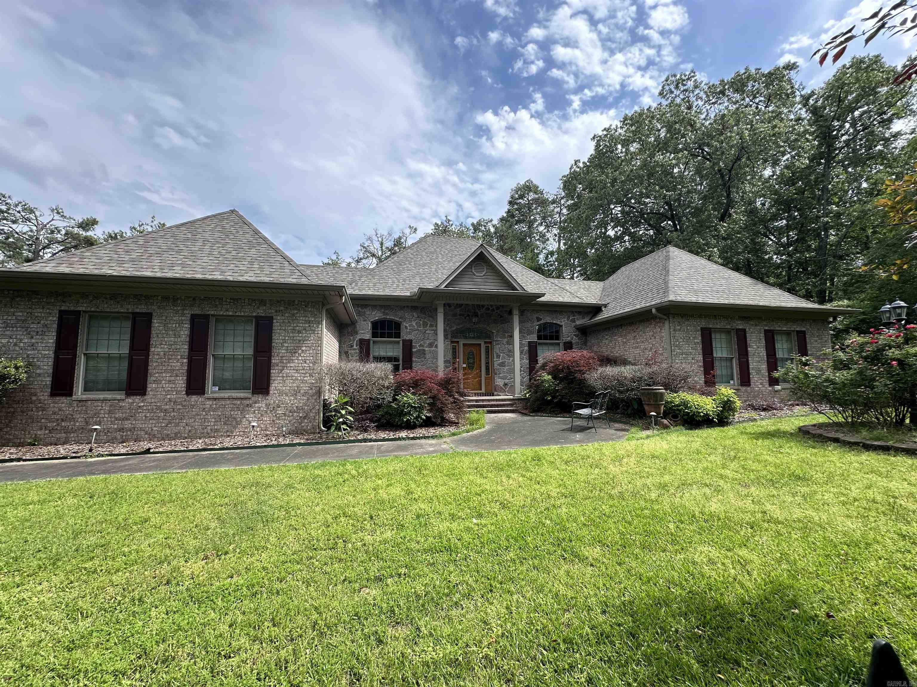 Very nice 3-bedroom, 2-bath brick home with garage, iron fencing, and a screened-in porch. Sitting on approximately 5 acres with beautiful landscaping and several trees, it offers a true country feel. The roof is approximately 2 years old, and the AC unit is about 5 years old. The home was built in 2002 with attention to detail, featuring high-end finishes such as Pella windows, tile flooring, custom-built cabinets, large customized closets, 3 open porches, a large concrete pad, and a gas fireplace. As you enter the home, youāre greeted by a dramatic entryway with soaring 12 ft ceilings, creating an open and luxurious feeling right from the start. The main bedroomās bath includes a garden tub, a spacious roll-in or walk-in shower, and a large closet