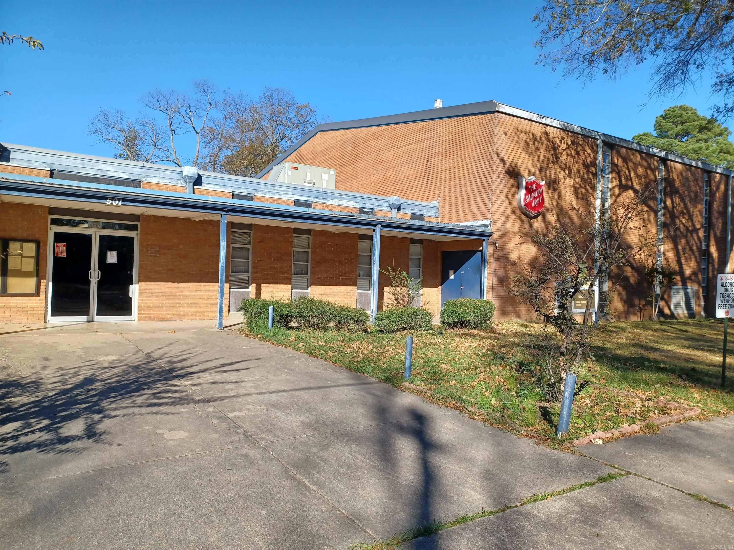 An exceptional opportunity to own a versatile commercial building in the heart of Pine Bluff! Currently operating as a Salvation Army facility, this property offers extensive space, excellent visibility, and adaptability for various uses. With multiple offices, 2 commercial kitchen spaces, separate dormitories complete with kitchen and living areas and on suite bathrooms this building could function in multiple ways. There is a huge gymnasium with wood flooring in perfect condition and bleachers to watch the games! A fully appointed sanctuary on the opposite end of the building is ready for services. Make your appointment today and make your business dreams come true!