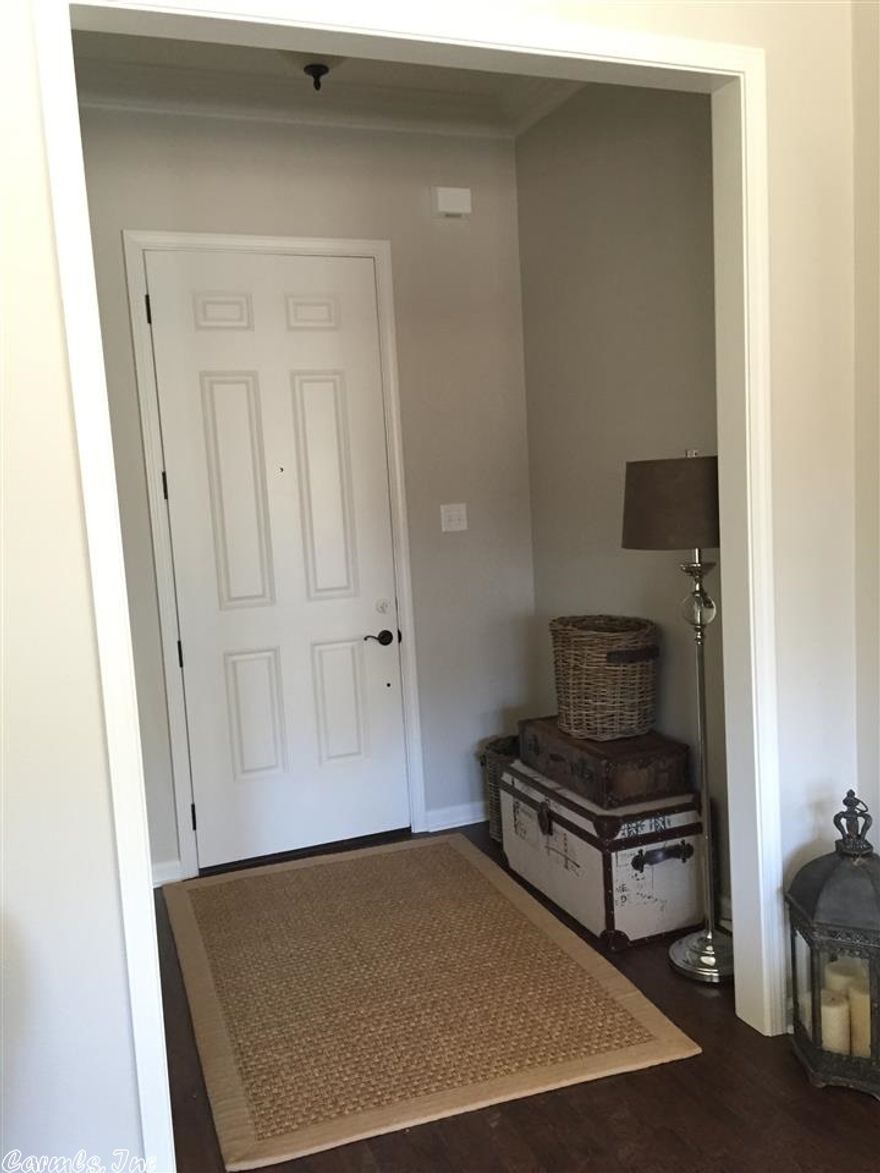 Brick and board and batten home, open floor plan, crown molding, huge island in kitchen, granite counter tops throughout, handscraped wood laminate flooring in all main areas. Large custom tile shower in master bathroom, covered back porch.