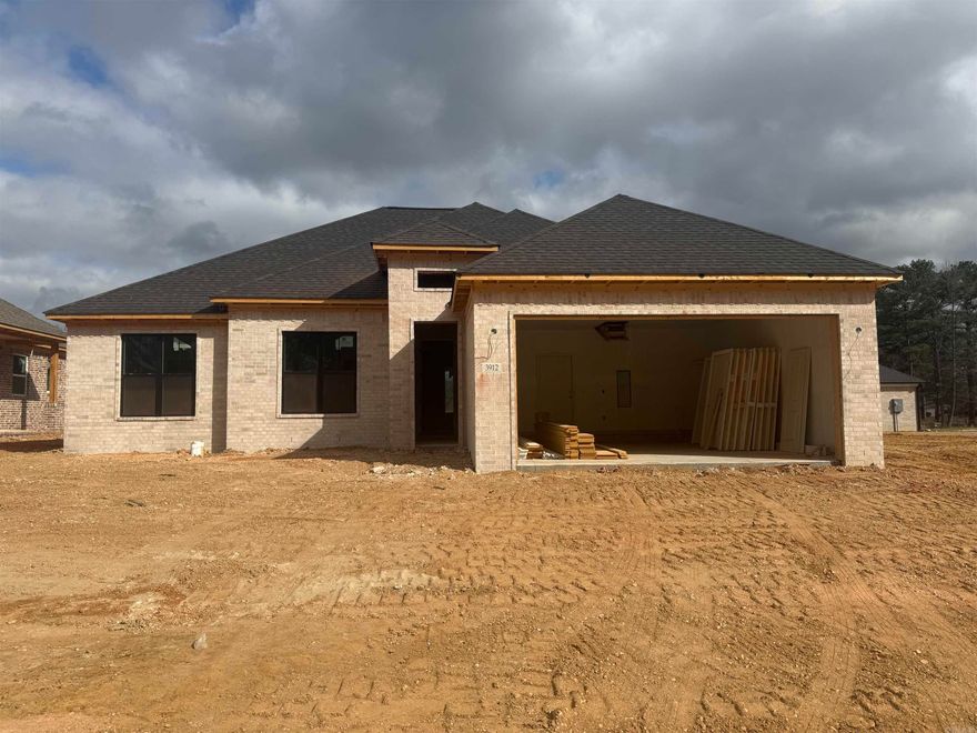 Welcome to your dream home in Benton’s premier subdivision, Spencer Crossing! This stunning brand new construction boasts a spacious split floor plan designed for modern living. Step into the heart of the home where custom-built, soft-close floor-to-ceiling cabinets adorn the kitchen, complemented by a freestanding stove & a convenient pantry for all your culinary needs. Cozy up by the brick gas fireplace in the open living area, perfect for entertaining or relaxing evenings at home. Retreat to the private primary suite featuring a luxurious primary bath complete with double vanities, soaker tub, and a large walk-in tile shower, offering a spa-like oasis right at home. The split floor plan ensures privacy with spacious spare bedrooms, providing ample space for family or guests. Step outside onto the covered porch & immerse yourself in the tranquility of the backyard, where you’ll love spending time in the expansive outdoor living space. Whether it’s morning coffee or evening gatherings, this home offers the perfect setting for enjoying the outdoors. Don’t miss out on the opportunity to make this beautiful home yours!