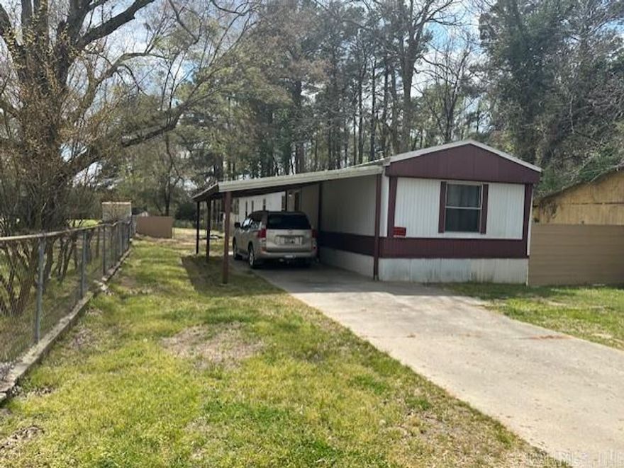 Updated mobile home on 0.64 acres.