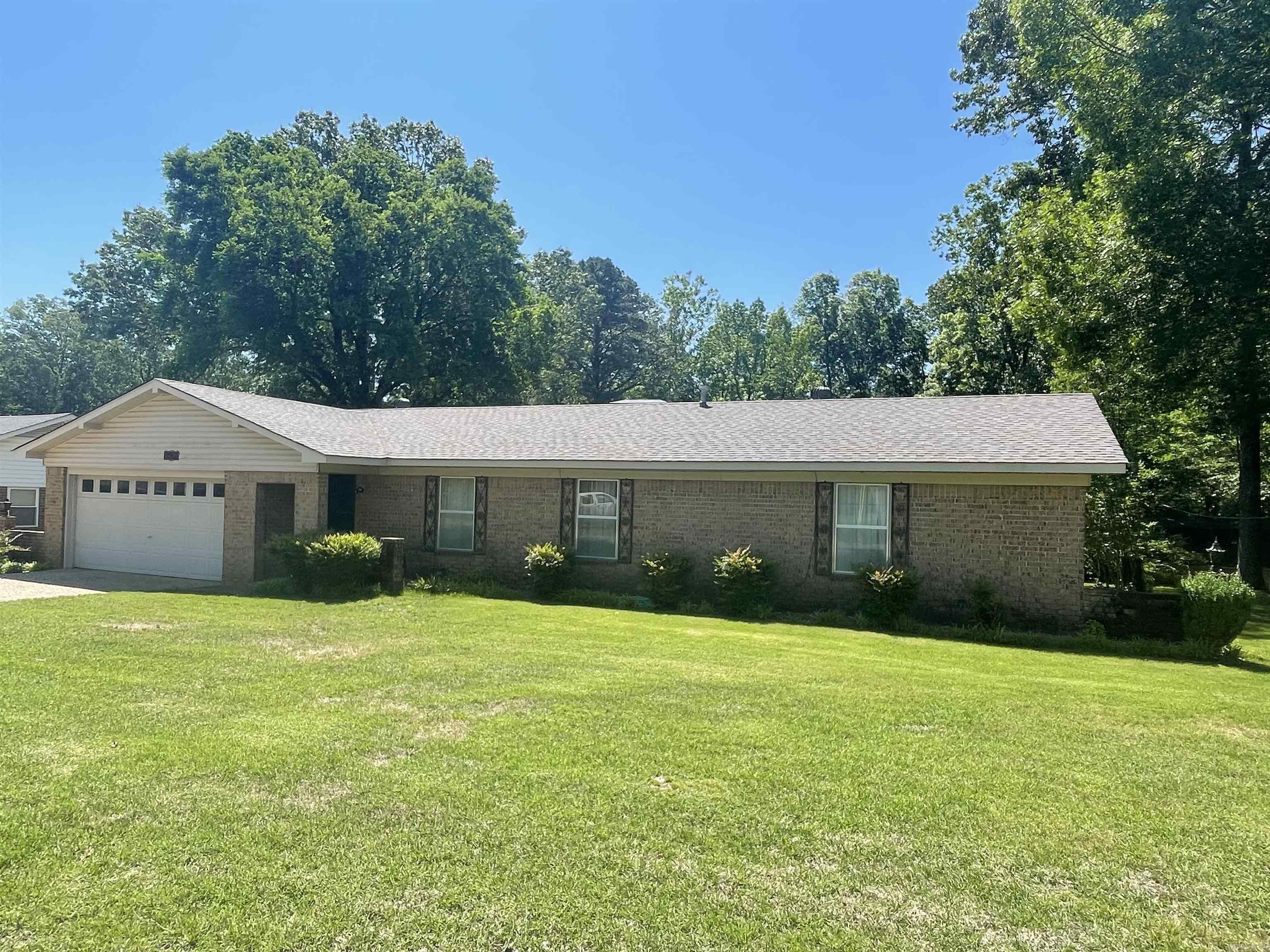 Estate - selling "as is" - no disclosure. Come take a look at this well maintained brick home in Hidden Valley Subdivision. The dining room was originally a formal living room but part of the wall was removed to open up into the den. The brick fireplace was not used by the previous owner. A new garage door opener and a new roof were recently added. New water heater in May 2022. Relax in the 12x22 heated and cooled sunroom and enjoy the birds and squirrels playing in the gorgeous back yard. The bonus room includes the washer and dryer space but the room is definitely large enough to be an office, playroom, hobby room, etc. The master bedroom and one of the other bedrooms are large enough to have a sitting area. There is a storage building for your lawn mower and garden tools. Sprinkler system has not been used in about 4 years. You will absolutely love the back yard which goes down to the creek. (The deed says to the middle of the creek.) It is almost an acre with lots of privacy in the wooded area at back. (Parcel #800-30502-000 and #805-15760-005) *Previous owner was mother of seller.