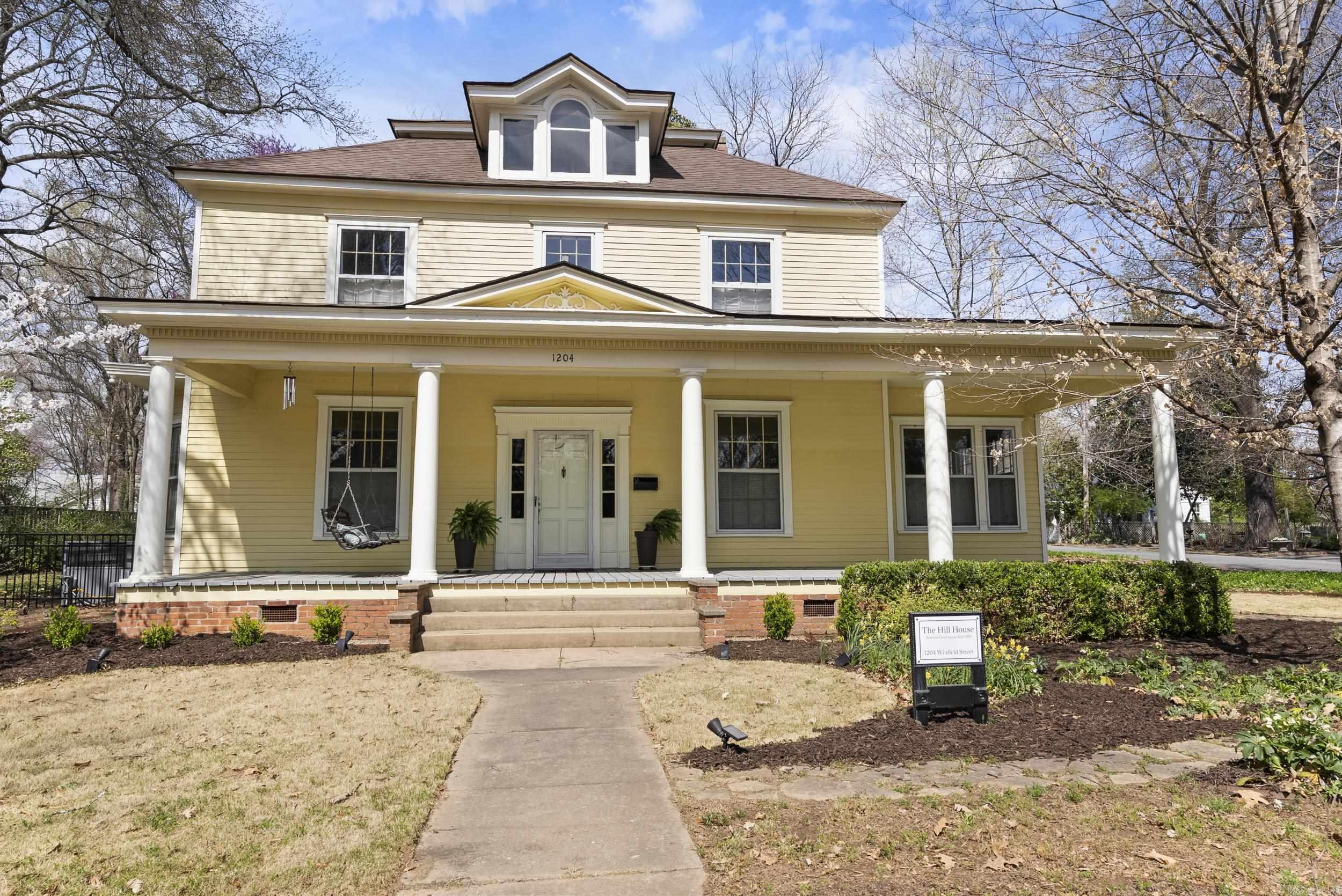 Historic Charm Meets Modern Comfort-The Hill House. Step back in time with The Hill House, a stunning 1903 American Four Square located directly across from Hendrix College in the heart of Conway, Arkansas. This 4 bedroom 2.5 bath home is rich in history while offering thoughtful updates for modern living. Inside you will find refinished original hardwood floors upstairs, freshly painted interiors, and an inviting layout that blends timeless elegance with comfort. The home boasts newer storm windows on the outside while maintaining the original windows on the inside, newer roof, fence, and a reinforced foundation (2023). The expansive sweeping front porch is perfect for morning coffee or evening gatherings, while the beautifully landscaped yard adds to the home's curb appeal. Home also has a tornado shelter under the carport. This rare gem is a must-see for history lovers and those who appreciate classic architecture. Don't miss your chance to own a piece of Conway's history--schedule your personal viewing today!