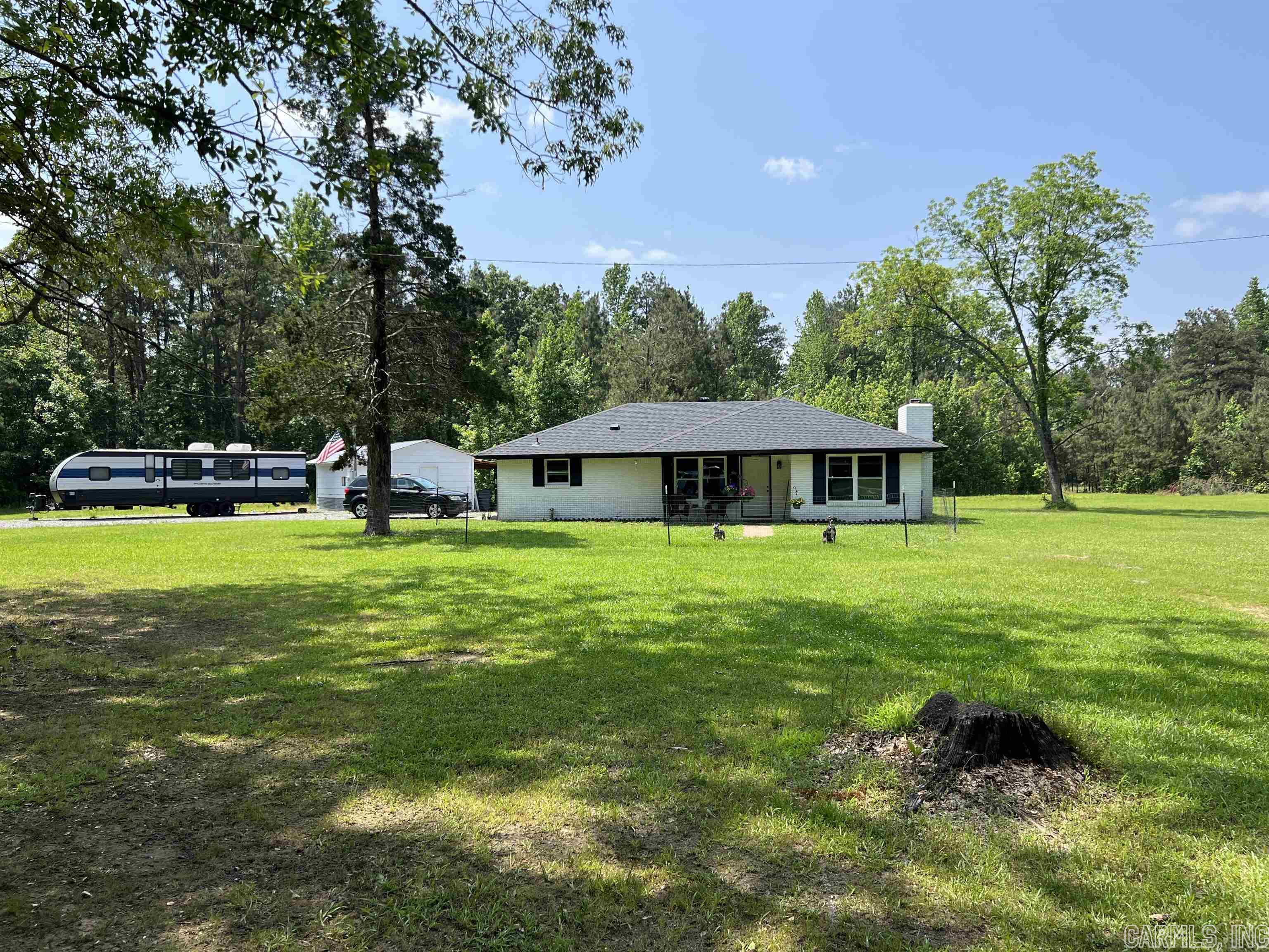 Beautifully remodeled two bed and one and half bath home with new roof, new driveway, all new appliances, new windows and doors, newer hvac unit, new hot water heater and recently pumped septic tank all on 3.32 acres. Peaceful country living! This home has a large laundry/storage room that could easily be used as a third bedroom if needed and a large outside storage building.