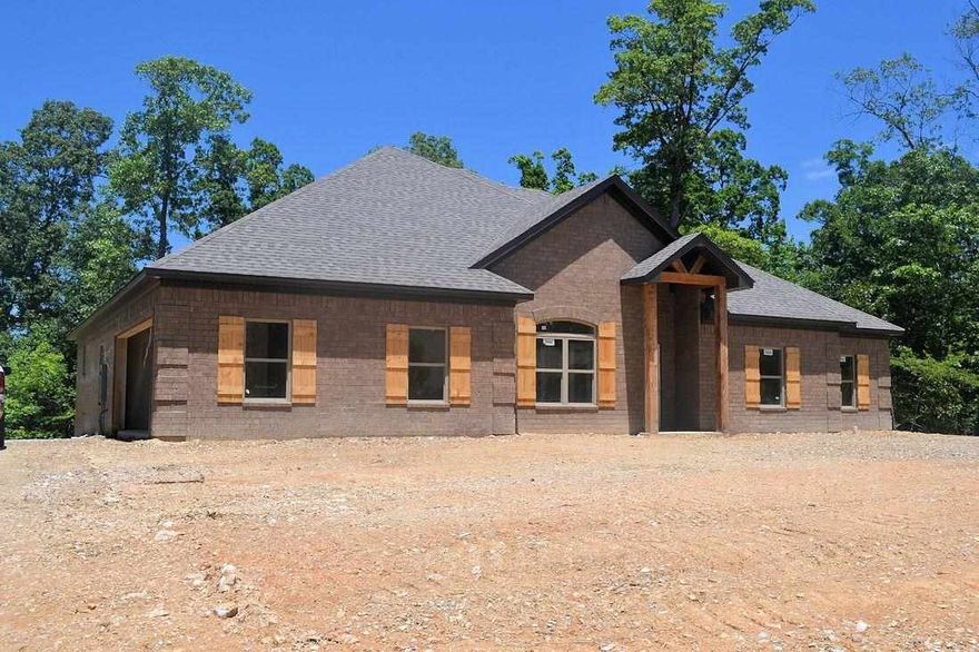 Gorgeous New construction home in Countryside Estates! Energy Efficient! Granite, hand-scraped hardwood floors & Extra crown molding throughout.  Open Floor-plan with a dream kitchen- Tons of storage! The  laundry room connects right into the master BR closet (which is HUGE!)! Sit on your large covered patio and watch deer on a little over 3 acres!  Amazing floor plan. 4 large bedrooms plus office or formal dining.  Bryant Schools! 1 year builder warranty.