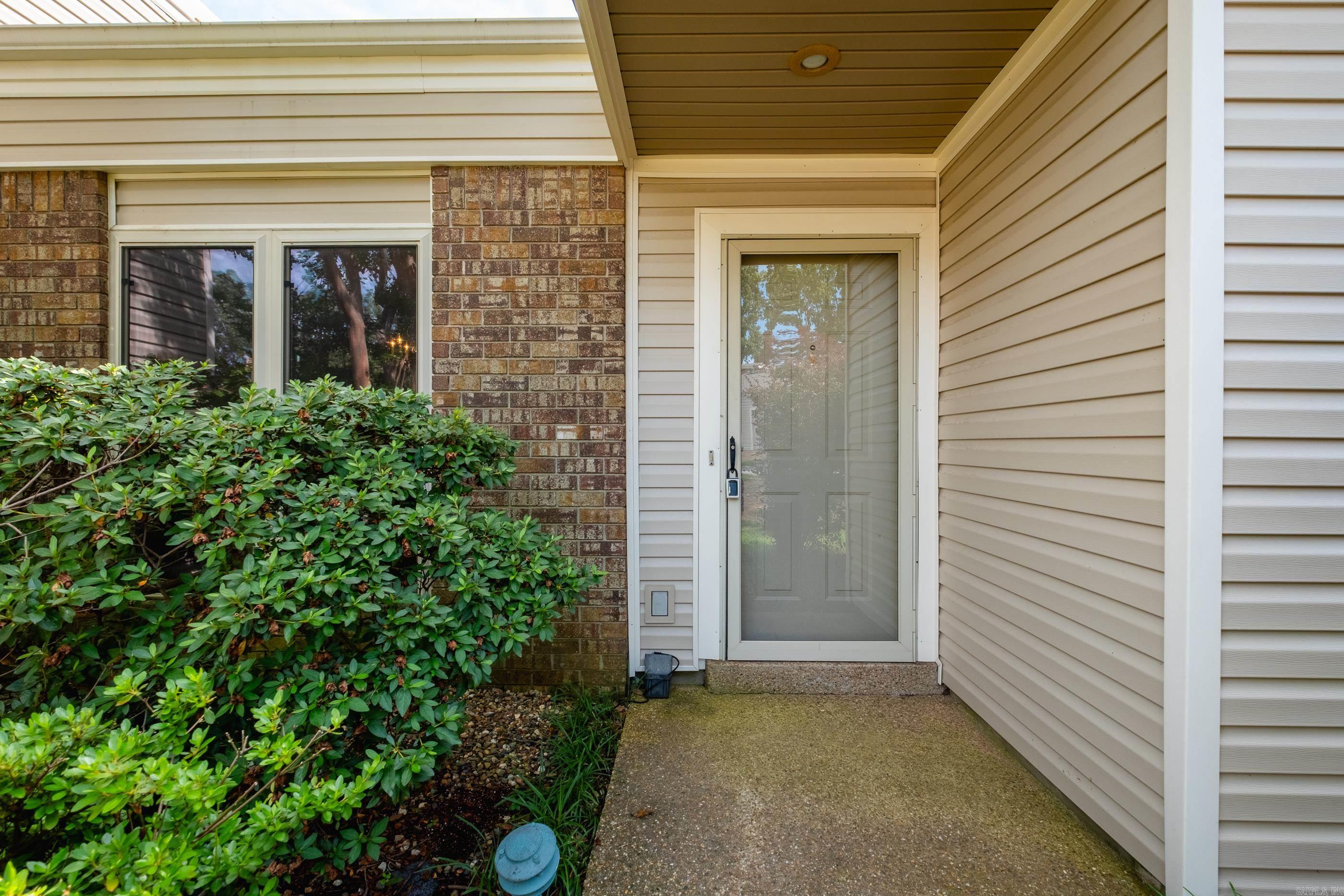 Charming One-Level Condo on Corner Lot ā No Carpet! This well-maintained one-level condo offers a versatile floor plan and a convenient location close to restaurants and shopping. The open living area features a gas log fireplace, built-in bookshelves, and flexibility for two separate living spaces. Enjoy meals in the formal dining room. Washer and dryer convey for added convenience! Step outside to your private patioāperfect for enjoying your morning coffee. Situated on a desirable corner lot with a two-car garage. The condo fee includes exterior maintenance, grounds upkeep, access to the community pool, tennis courts, and clubhouse. Donāt miss this oneāschedule your showing today! Agents, please see remarks.