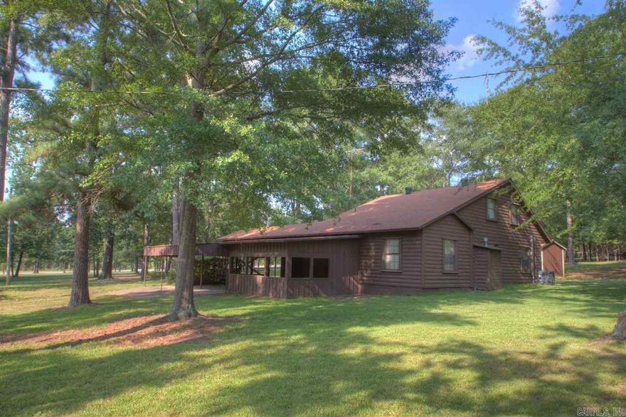 SECLUDED LOG CABIN JUST OFF GENOA RD IN THE CITY LIMITS OF TEXARKANA AR.  THIS 4 BEDROOM, 2 BATH HOME FEATURES TONS OF OUTDOOR SPACE FOR RELAXING.  TWO COVERED PATIOS & A LARGE 2 CAR COVERED CARPORT ATTACHED TO HOME.  NESTLED AMONGST THE TREES, YOU GET TONS OF PRIVACY WHILE BEING ONLY MINUTES FROM SCHOOLS & SHOPPING.