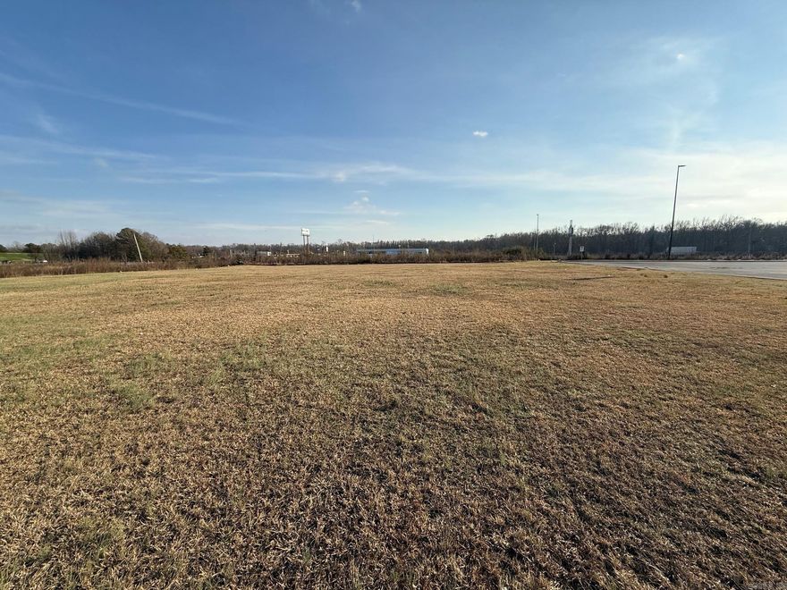 We have a prime 1 acre commercial lot right in front of Walmart, perfect for your future business.