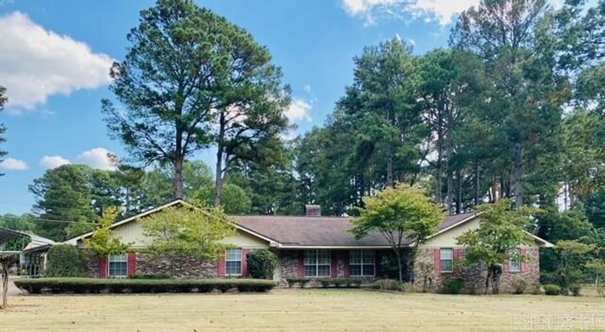 Something for everyone in this beautiful brick home on an oversized lot. A brick foyer welcomes you into the living room area complete with fireplace with gas logs. The kitchen/dining area with bay window has great cabinet space, solid surface counters and easy access to the garage with 2 large storage rooms. Nice size laundry room off of the kitchen area. The inviting rear covered patio has French doors into the living room & into the spacious family room with wood floors & gas log fireplace.    French doors lead into the primary bedroom from the rear hallway. En-suite bathroom has double walk-in closets, double vanity & walk-in shower. The other two bedrooms also have walk-in closets and are nice size rooms.    The outside boast well manicured landscaping, fenced yard and sprinkler system. The bonus is the 28' x 20' workshop with overhead door and built in workbench complete with electricity. 16' x 30' RV shed and separate 12' x 20' detached carport. Do not let this one get away! Call Ramona today!    Call Century 21 Campbell & Company for appointments 870-837-2121  Square Footage, Year Built and Lot Size taken from Courthouse Records.