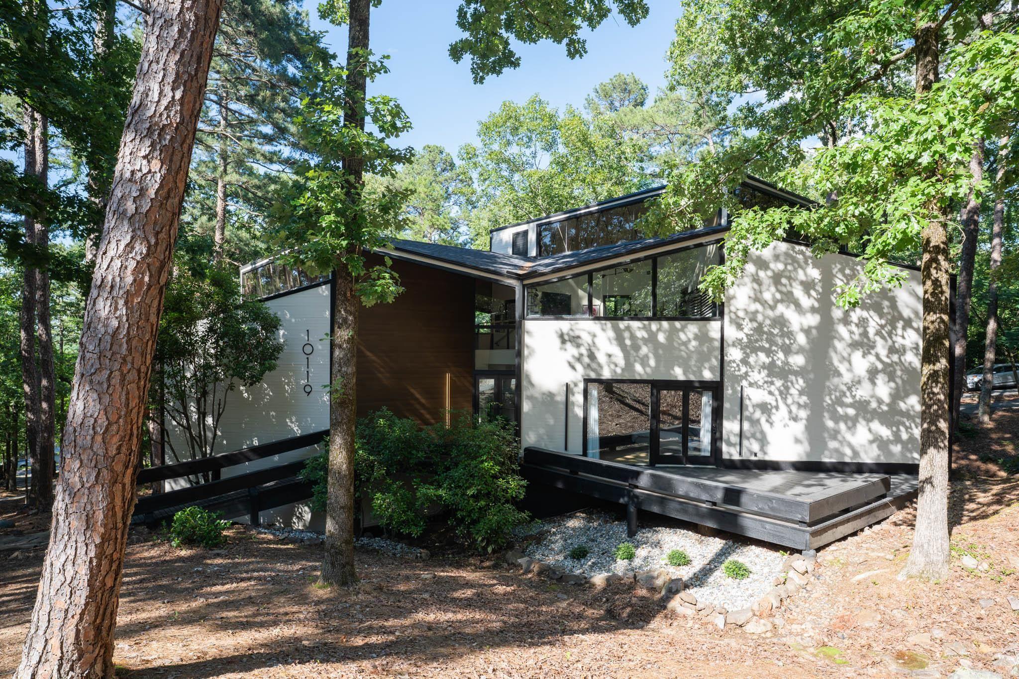 Beautifully Updated Contemporary Home Just Minutes from West Little Rock! Enjoy the best of both worlds with this contemporary-style home located outside city limits, offering a peaceful country setting only 15 minutes from the Chenal Promenade. This fully remodeled property by Cahill Designs features refinished hardwood floors, carpet, and fresh paint inside and out. The updated kitchen includes granite countertops and new tile flooring, which extends into the sunroom. Bathrooms have been fully renovated, and updated fixtures and staircase rails add a modern touch throughout. Additional upgrades include a new roof, making this home move-in ready with major improvements already completed. A must-see for buyers seeking space, style, and convenience. *Agents See Remarks*