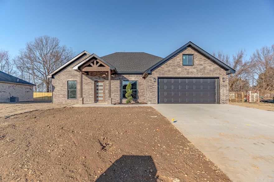 Welcome to Market 217 Woodland Trail in Bono, AR!  This Beautiful New Construction all Brick home is a true Gem!  With a walk-in shower in the master bathroom; a Cambria stone island in the kitchen; Covered Patio in the back; Electric fireplace in the living room; vaulted ceilings; Beautiful cabinets;  this home has it all!   Come see today!  Will be completed soon!