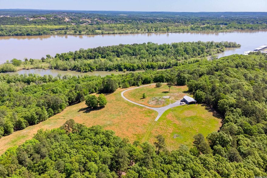 This spectacular property features magnificent bluff with panoramic views of the Arkansas River and surrounding area. Property offers tremendous opportunity for development into personal estate or gorgeous home sites. Located adjacent the Yacht Club, River Estates and Pinnacle State Park.  Special opportunity.  Please call listing agents for more detailed information. Island not part of sale but could be purchased.
