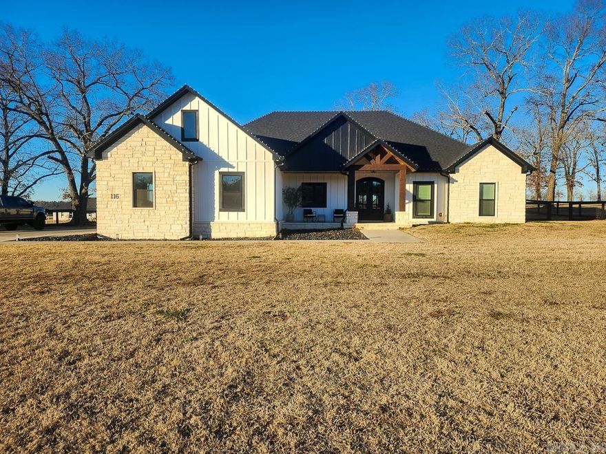Built in 2024, this exceptional home offers 2,409 square feet of thoughtfully designed living space on a full one-acre lot in the desirable Republican Valley Estates subdivision, located in the Greenbrier School District and outside city limits. This traditional, site-built home sits on a slab foundation and features a timeless brick exterior with side-entry, two-car garage for enhanced curb appeal. Inside, the split floorplan provides both privacy and functionality, with LVP flooring throughout and beautiful granite countertops anchoring the home’s modern aesthetic. The open-concept living area showcases an electric fireplace, a large kitchen island with breakfast bar seating, and a generous dining space ideal for everyday living or entertaining. A standout feature is the hidden walk-in pantry, cleverly concealed behind cabinet doors in the kitchen. The primary suite is a true retreat, offering double vanities, a walk-in shower, a soaker tub, and an enormous walk-in closet you truly have to see to believe. Enjoy the outdoors from the oversized, north-facing back porch—perfect for shaded afternoons and relaxing evenings. With public water, septic, and all-electric appliances.