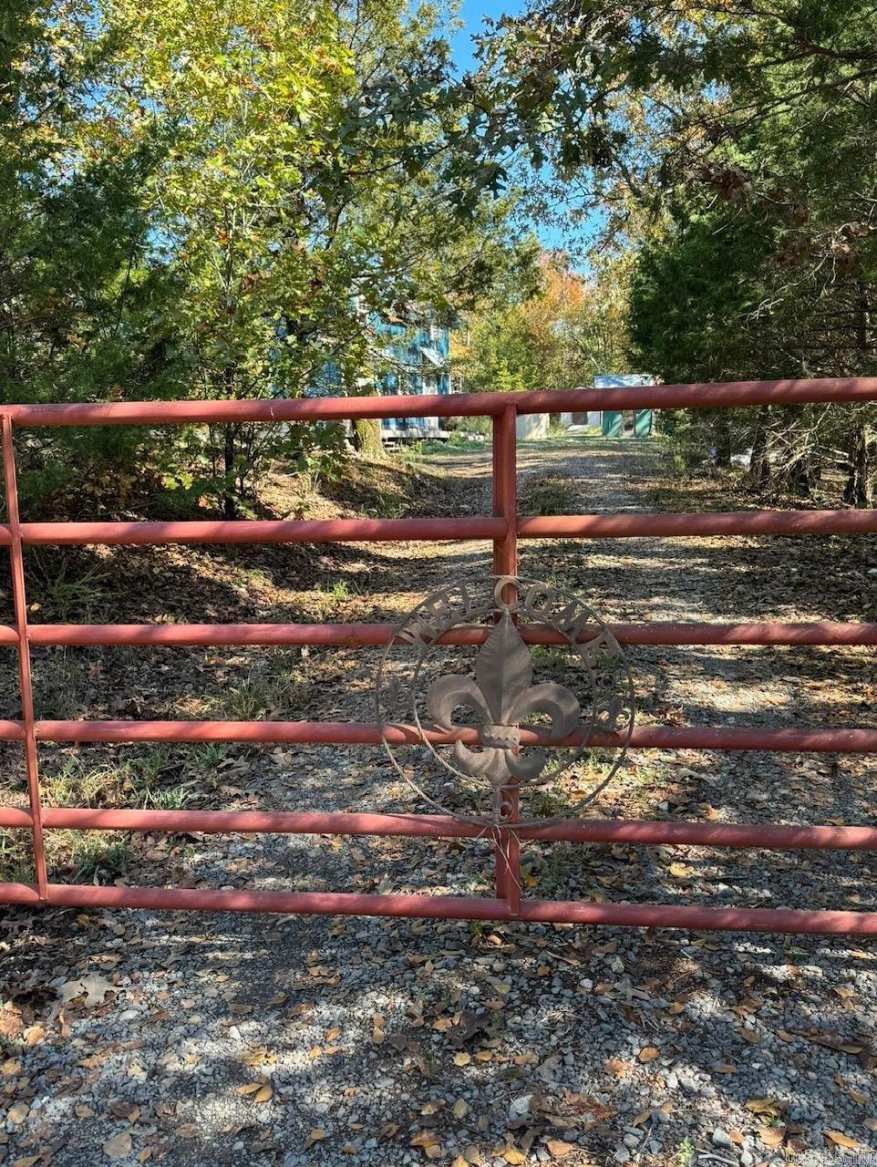 Discover this beautiful property just minutes from downtown Conway. This 2.99-acre land is perfect for building your dream home. The property features a studio building ideal for projects, multiple storage buildings, storm shelters, a 2021-installed well, electrical service, a gated entrance, and partial fencing. For more information, please contact me.