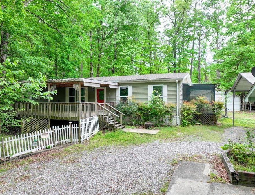3-bedroom, 2-bath manufactured home built in 2015, offering approximately 1,560 sq ft on about 1 acre. Located just minutes from Denby Marina on Lake Ouachita, with convenient access to boating, fishing, and outdoor recreation.  The home features an open floor plan with granite countertops and a functional layout suited for full-time living or a weekend retreat.  The property is set up for both everyday use and storage needs with a detached 2-car garage, additional 2-car covered parking, and a separate shop/outbuilding for workspace or extra storage. There is also dedicated RV parking with hookup, plus room for boats or trailers.  A whole-house generator provides backup power, and the one-acre lot offers space and flexibility in a quiet setting.  Mount Ida is known for its proximity to crystal mining and outdoor activities, making this a solid option for a primary residence, second home, or rental near Lake Ouachita.