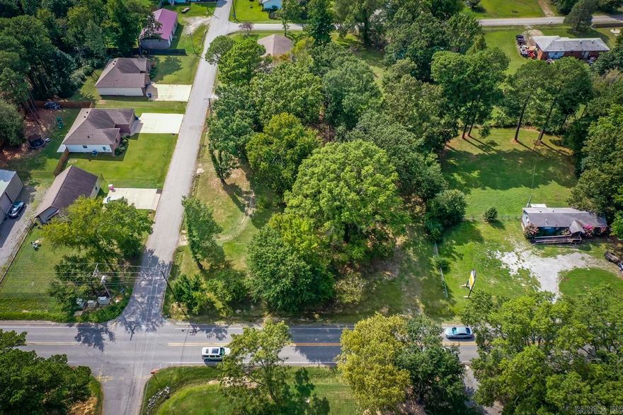 Conveniently located on a high-traffic roadway, this commercial lot offers outstanding visibility and exposure for your future business. Zoned C-2, the property is suitable for a wide variety of commercial uses, making it an excellent investment opportunity. Whether you’re considering a bakery, coffee shop, retail store, boutique, office space, medical or professional services, daycare, salon, auto-related business, convenience store, or mixed commercial development, the possibilities are extensive. Existing trees provide flexibility, keep them for natural beauty and shade or clear the site to maximize your development plans. If you’ve been searching for a location with strong traffic counts and exceptional potential, this property deserves a closer look. Total lot is 0.69-acre. To be sold with MLS 26021761