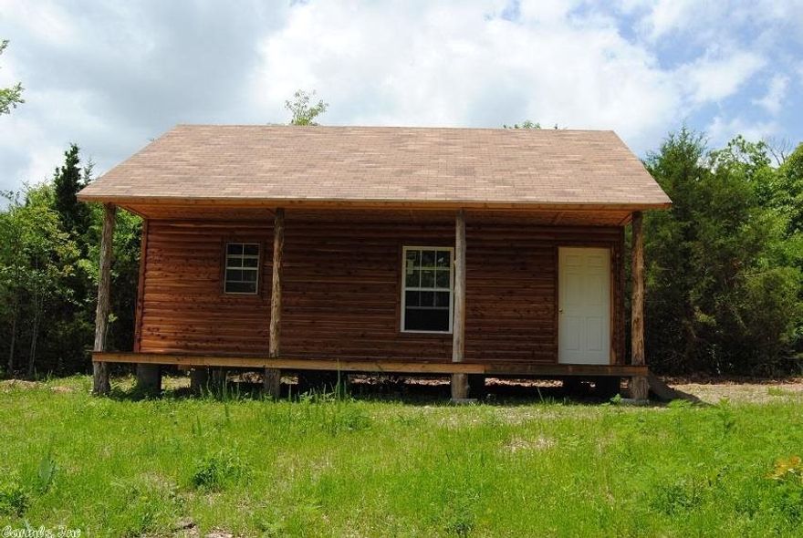 UNFINISHED CABIN, READY FOR YOUR DESIGN, HAS WATER, ELECTRIC AND SEPTIC, 600 SQ.FT. CABIN, HAS FINISHED CEDAR LOGS ON OUTSIDE, NEAR THE BUFFALO RIVER AND BRUSH CREEK, GREAT HORSE BACKING RIDING AREA, HIKING, FISHING, CAMPING, OWN A PIECE OF THE OZARK'S  PLACE TO HICK UP YOUR HORSE AND SIT ON A COVERED PORCH, THIS IS A NEW DESIGN IN THE CABIN , HAS MORE ROOM INSIDE, LOFT BEDROOM, CHECK THIS ONE OUT, I THINK YOU WILL LIKE IT, HAS A SEPTIC AND WATER TO HOUSE, THIS IS PRICED TO SELL!!!
