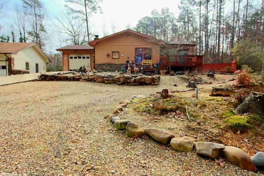 Cute as a bug! This home has laminate floors and a gorgeous Arkansas room. The roof was replaced in 2006. It has a Trane heat pump. The back yard is fenced. Large deck in front and a rear deck with a Sunsetter remote control awning. Kitchen has a slate breakfast bar and glass top range.  But, look at this, A SEPARATE WORKSHOP BUILDING! County has square footage at 1192 but there is a heated and cooled sun room added 254 square feet