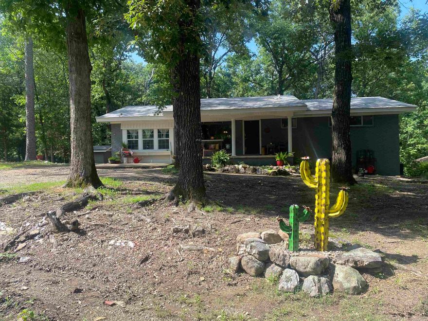 Just the right location and a great house to boot! This 1624 square foot home located in the Bearce Subdivision is only about 5 minutes to Twin Creek boat launch on beautiful Lake Ouachita. The house is suited to fit your family and friends when they visit with 3 bedrooms and 3 baths along with a relaxing sun room for more space. The combination living/dining area features a wood burning fireplace and high quality laminate flooring which is very easy to maintain. Each bathroom has updated features including custom tile showers/bath combos. The large third bedroom could easily transform into a den or family TV room. Outside, you will enjoy a large deck off of the back of the house and storage in the basement area. There is an extra lot beside the house to build your shop or to just have space to roam. Call today!  $250,000.00