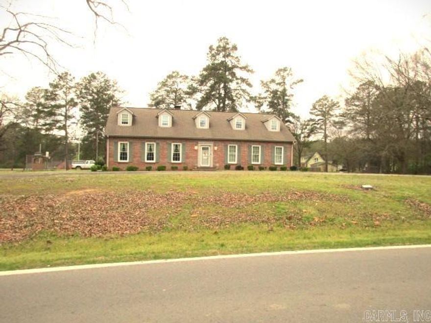 Great location on the corner of Main Street and Mockingbird, across from the Cleveland County School.  This beautiful 2 story home has 4 bedrooms and 3 1/2 baths.  Home has carport, courtyard, barn and shop.  Additional home at 713 Main. Tennis/basketball court.