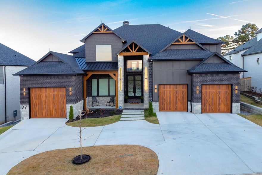 Introducing an exquisite custom-built residence by Randy Wright. This remarkable home features a stunning exterior, harmoniously blending brick, stone, and hardy board, while the entryway enchants with its undeniable charm and curb appeal. Upon entering through the impressive 10-foot tall double iron doors, you'll be greeted by a magnificent foyer that showcases expansive picture windows and sweeping views of the surrounding treetops. The kitchen is a true culinary haven, complete with luxurious Cambria marble countertops and designed within an inviting open floor plan. Noteworthy highlights throughout the home include a hidden pantry, a media room with secret access cleverly concealed behind a bookshelf on the second floor, and a breathtaking, one-of-a-kind wine cellar adorned with an arched stone ceiling and walls on the lower level, which leads to a tranquil hot tub oasis. With details such as fluted walls, coffered ceilings, oversized baseboards, decorative wall paneling, and floating vanities, every inch has been thoughtfully curated to create a truly extraordinary living environment. Welcome to the home of your dreams!