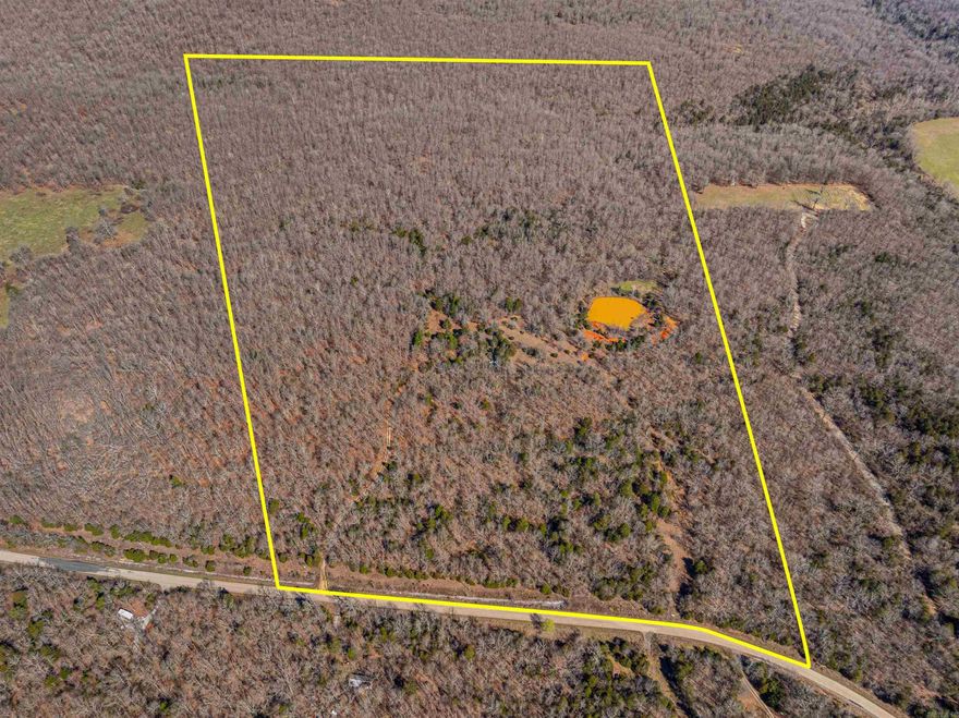 Welcome to the market this beautiful long-time family owned piece of heaven! When you enter the gate which is about road midway of property, you will drive up the driveway to the small hunting cabin which will shield you from the elements but needs some love. On the property are several 4 wheeler trails that will take you to multiple cleared spots, some with old blinds and stands still in place. Multiple large whitetail deer have been harvested from this property over the years. Turkey and hogs have been spotted as well! To attract the wildlife is a large runoff pond that holds water year round but never completely fills. At the rear of the property is a wet weather creek. An old house place with an old well is just another of the amazing features that this property boasts. The condition of the well is unknown. Also discovered on the property is now registered but unexplored cave called "Perry Cave" which is named after the owners! The mixed and some mature hardwoods, water features and gorgeous views are just some of the reasons you should buy this once in a lifetime property in the beautiful foothills of the Ozark Mountains!!!