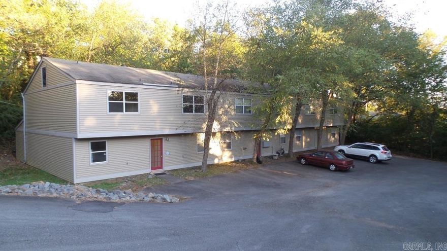 Welcome to 7711 South Street in Little Rock's Bellevue subdivision in the Cantrell and Mississippi area.  This townhome complex (6 identical 2 story units) provides great income opportunity. 4 Units currently rented.  2 Vacant.  Well maintained with very little repair expenses.  Each unit features 2 bdrms upstairs with full bath upstairs, with washer/dryer connections.  Downstairs features large living room/dining room combination, kitchen, fireplace and half bath.  Each unit has its own back patio with 2 storage closets.  LVP flooring, refrigerator, range, dishwasher and central HVAC in each unit.  Sitting in a convenient location of the popular Heights area. Washer and dryer connections available in unit. Provides quiet and peaceful area with quick access to all Little Rock amenities. See showing and agent remarks.