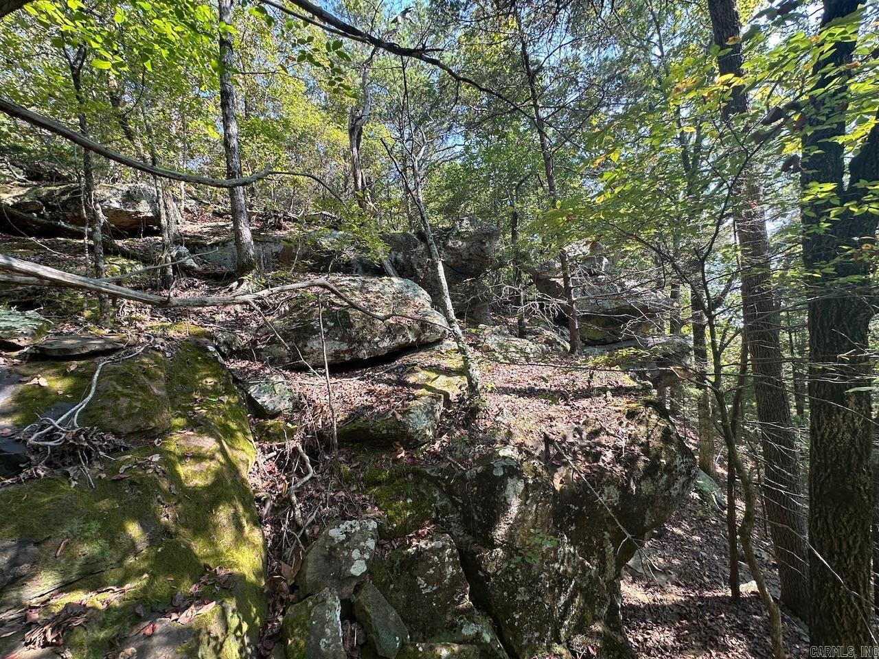 This 10.14 acre tract is easy to access by way of a gravel road (Gassaway Lane) and deeded easement that ends at the acreage. The mineral rights do convey with the sale of the property. There is a road bed that leads to a great building site in the woods away from the existing gas pad. With some clearing of trees there would be an incredible view of the valley below and the hills surrounding the area. Power and water are very close by. No building restrictions. Property lines on photos are approximate.