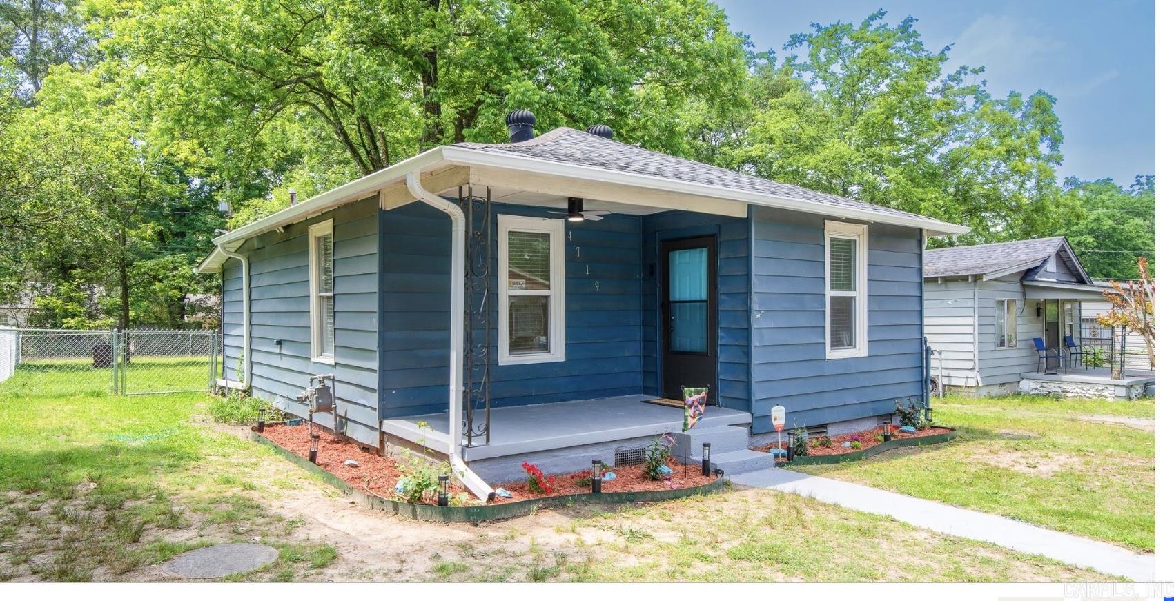 This home is ready for move-in. The home was renovated: Upgraded kitchen, bathroom, new appliances, new floors throughout, freshly painted, light fixtures, wall air conditioning & heating, lots of windows, including window over sink for your planter, new roof, large fenced backyard ready for entertaining. This won't last long, call us to reserve your private showing. NOTE: Photographs of living room and master bedroom displays Virtual Staging/Digital Enhancements.