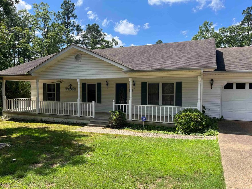 PRIVATE, CUTE ONE STORY, WITH LEVEL DRIVEWAY. COVERED PORCH W/CEILING FANS, REAR DECK OFF THE KITCHEN.  $1,500 ONE TIME BUY-IN FEE