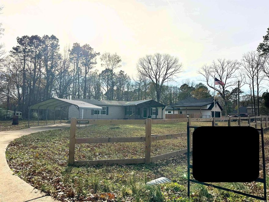 Tucked away on a peaceful cul-de-sac street, minutes from historic downtown Benton, Arkansas, this charming manufactured home on a permanent foundation, feels like a quiet country retreat wrapped in the convenience of town. Resting on approximately three-quarters of an acre, the property offers room to grow and take in all of life's moments from the large covered deck!  Step inside and you’re greeted by a large, open living room, warm and inviting, the perfect place to gather, unwind, or simply let sunlight spill through the wall of windows as the day drifts by. The huge kitchen is the heart of the home—crafted for conversation, laughter, late-night snacks, and slow Sunday mornings. There’s space to cook, space to create, and space to fall in love with the everyday moments.  The huge master bedroom feels like its own private sanctuary, but the real treasure is the master suite—an indulgent escape featuring a luxurious walk-in shower that melts the world away and walk in closet space that is fit for a Queen!  Two additional bedrooms offer comfort for family, guests, or a quiet home office.  Surrounded by serenity and only two minutes from the new bike park and trails!