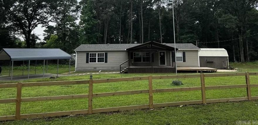 Tucked away on a peaceful cul-de-sac street, minutes from historic downtown Benton, Arkansas, this charming manufactured home on a permanent foundation, feels like a quiet country retreat wrapped in the convenience of town. Resting on approximately three-quarters of an acre, the property offers room to grow and take in all of life's moments from the large covered deck!  Step inside and you’re greeted by a large, open living room, warm and inviting, the perfect place to gather, unwind, or simply let sunlight spill through the wall of windows as the day drifts by. The huge kitchen is the heart of the home—crafted for conversation, laughter, late-night snacks, and slow Sunday mornings. There’s space to cook, space to create, and space to fall in love with the everyday moments.  The huge master bedroom feels like its own private sanctuary, but the real treasure is the master suite—an indulgent escape featuring a luxurious walk-in shower that melts the world away and walk in closet space that is fit for a Queen!  Two additional bedrooms offer comfort for family, guests, or a quiet home office.  Surrounded by serenity and only two minutes from the new bike park and trails!