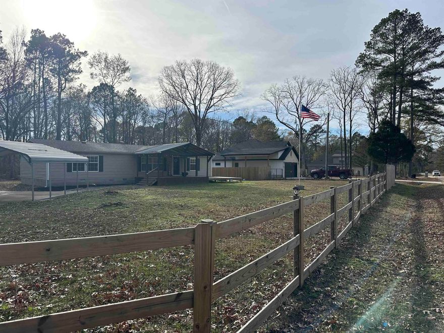 Tucked away on a peaceful cul-de-sac street, minutes from historic downtown Benton, Arkansas, this charming manufactured home on a permanent foundation, feels like a quiet country retreat wrapped in the convenience of town. Resting on approximately three-quarters of an acre, the property offers room to grow and take in all of life's moments from the large covered deck!  Step inside and you’re greeted by a large, open living room, warm and inviting, the perfect place to gather, unwind, or simply let sunlight spill through the wall of windows as the day drifts by. The huge kitchen is the heart of the home—crafted for conversation, laughter, late-night snacks, and slow Sunday mornings. There’s space to cook, space to create, and space to fall in love with the everyday moments.  The huge master bedroom feels like its own private sanctuary, but the real treasure is the master suite—an indulgent escape featuring a luxurious walk-in shower that melts the world away and walk in closet space that is fit for a Queen!  Two additional bedrooms offer comfort for family, guests, or a quiet home office.  Surrounded by serenity and only two minutes from the new bike park and trails!