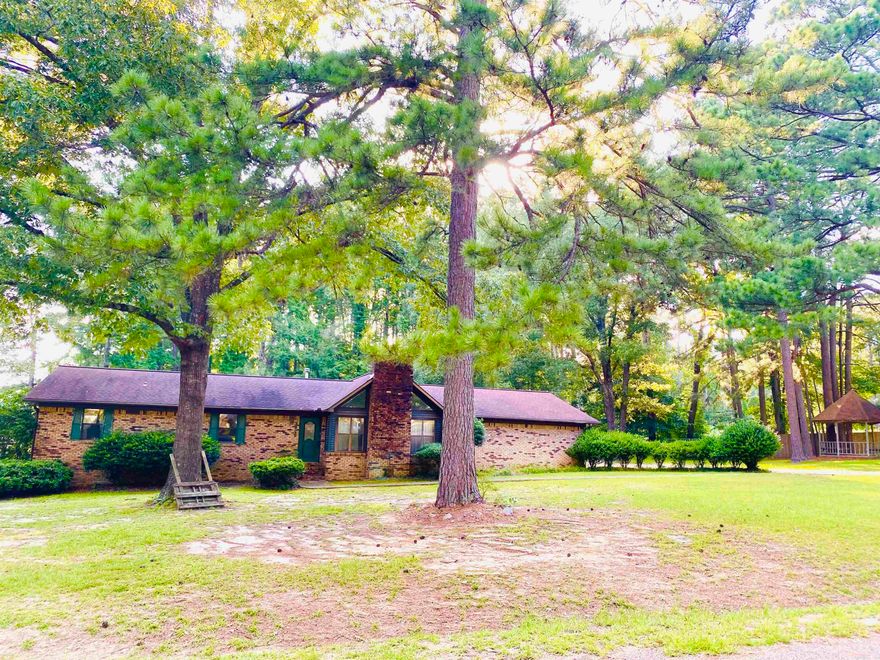 Just outside the city limits, 3670 Braxton offers space, privacy, and potential! This 4 bedroom, 2 bath home sits on 2.06 peaceful acres, giving you a quiet country feel with the convenience of Camden nearby. Inside, the large great room features vaulted ceilings and a cozy fireplace, perfect for relaxing or entertaining. The home also includes a 2 car garage and plenty of room to grow. With a little updated, this property could truly shine. Don't miss your chance to make it your own.