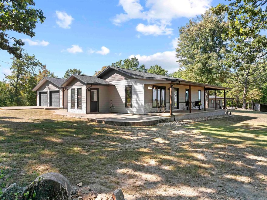 Lakefront living at its finest—with over 800 feet of Corps of Engineers frontage on Bull Shoals Lake setting the stage for your Ozark dream lifestyle. From sunrise coffee on one of three porches to summer evenings on the freshly updated deck, every moment here connects you to the water. This 5-bedroom, 3-bath home has room for everyone, with an oversized family room, perfect for game nights & a basement plumbed for a second kitchen—ideal for a mother-in-law suite or entertainment zone. A safe room offers peace of mind, while a brand-new Generac generator & 500-gallon propane tank keep things running worry-free. Outdoors, the property is built for lake life: a workshop with drive-thru garage, plus dual carports & heated with a woodstove—perfect for year-round projects or storage. Boat slip with lift at Hwy 125 Marina is available with an acceptable offer—making lake days effortless. Abundant wildlife, endless privacy, & direct access to Bull Shoals Lake… this is more than a home, it’s a lifestyle.