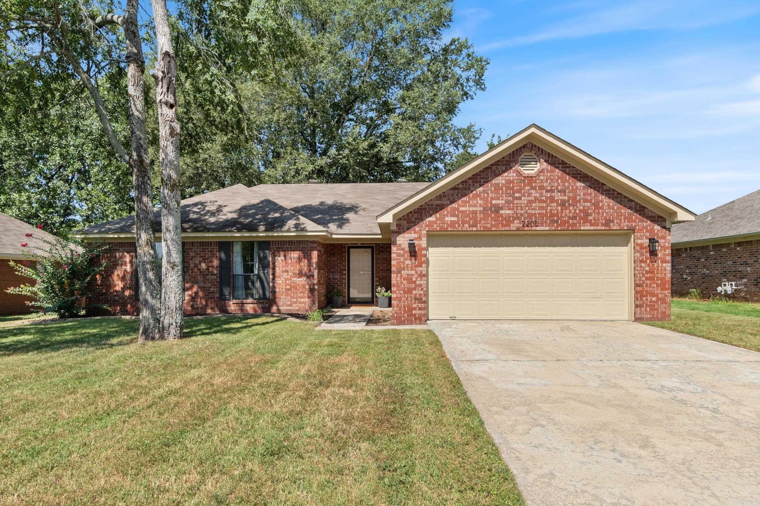 This charming 3-bedroom, 2-bath home is move-in ready and full of recent updates. Inside, you'll find all new interior paint, stylish new fixtures, and stainless steel appliances. The spacious living area features vaulted ceilings and a cozy fireplace, creating the perfect spot to relax or entertain. The kitchen offers ample storage, a built-in microwave, and the refrigerator conveys at no value. Step outside to enjoy the newly landscaped yard, a wood privacy fence, and a generous patio for outdoor gatherings. The outdoor storage shed will also convey at no value. Other updates include new landscaping and exterior lighting. This property sits on a level lot in Rainwood Subdivision and is close to dining, restaurants and interstate access!