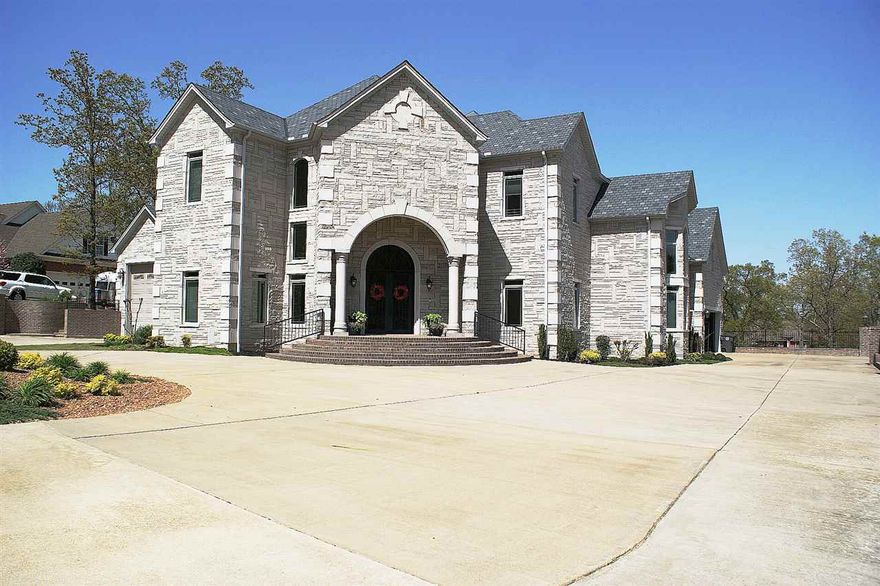 You too can now own the Castle. Upscale living doesn't have to cost extra. Beautiful 5 BR 4 2½ BA 6800sqft home. Home features a beautiful open floor plan with 3 levels, crown molding, recessed lighting, fireplace, vaulted ceilings, 19’ ceilings in living area, and scored concrete floors. Kitchen has upscale glazed custom cabinetry with pull outs, granite counter tops, and stainless steel appliances. Master bedroom has a separate office space and walkout to a covered patio and 20x40 salt water pool.