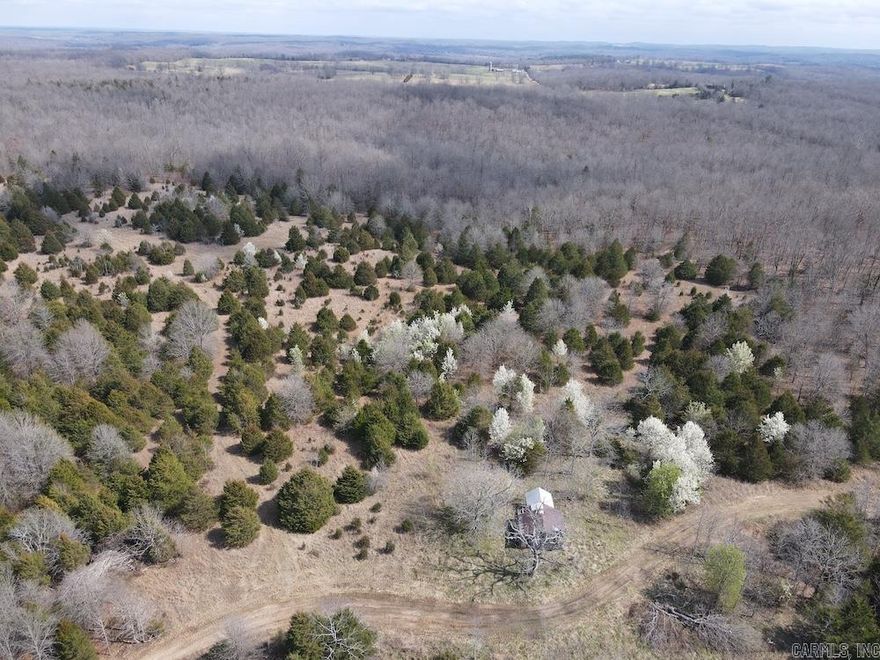 Located in the rolling Ozark hills near Salem and Viola, this unrestricted Fulton County property offers excellent hunting, diverse terrain, and several potential building sites. Access comes from a gravel county road, and the rolling topography provides ideal locations for stands, food plots, or pasture. A recent select timber cut has created thick young regeneration that provides outstanding bedding cover for deer, while younger hardwood stands, including red oak and other mast-producing trees, supply food for wildlife. Deer sign is common throughout the property with rubs, scrapes, and natural travel corridors along ridges and pinch points. Turkey numbers are strong thanks to the mix of hardwoods, thick cover, and open edges. Near the center of the property sits a large old field with native grasses, cedar thickets, and brushy edges that create excellent wildlife habitat. A small spring fed pond provides a reliable water source and an attractive location for a future cabin site. With strong hunting potential, water on the land, and no restrictions, this tract is well suited for recreation, hunting, or a private Ozark getaway.
