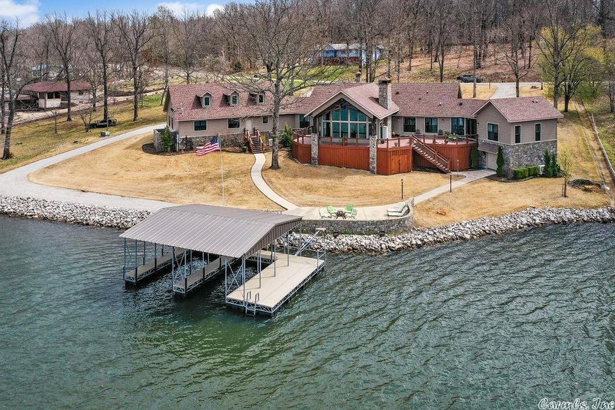 ALLURING LAKEFRONT LUXURY...3 Brms, 3.5 Baths, 3 Lots (no corp strip), 3 Fireplaces, 4 Car Garage, Lakeside Patio, Safe Room, 48' Room (easily converted to special needs or interests). Luxury delivered on a silver platter of pleasure, from the grand entry to the boat dock. Split living for residents, long or short-term guests. Spectacular views reflecting exceptional tastes with craftsmanship that makes lives richer in every sense of the word. Fabulous luxury vacation rental income potential in the Ozarks.