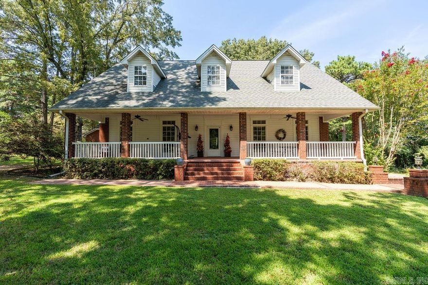 This charming brick home offers three comfortable bedrooms and 2 1/2 baths, providing ample space for family living or hosting guests.   A dedicated game room perfect for entertainment and relaxation.  A quiet office space ideal for working from home or managing household tasks.  The property spans a generous 10 acres, offering plenty of space for outdoor activities and privacy.  The property is enclosed by a pristine white PVC fence, adding both elegance and security.  A serene pond enhances the landscape, perfect for relaxing by the water or enjoying some quiet fishing.  The home features a detached garage with a full bath, providing ample space for vehicles, storage, or even a workshop.  The backyard boasts a large deck, perfect for entertaining guests. Imagine hosting barbecues, family gatherings, or simply enjoying a quiet evening under the stars. This deck is an ideal spot for outdoor dining, lounging, and making the most of your beautiful surroundings.