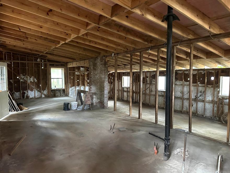 Nice corner lot in established subdivision.  This property has been gutted down to the studs. Plumbing is present for original kitchen and bath.  An additional bath can be added. The 1158 sq ft structure has new roof framing, new roof insulation, new metal roofing, and new door and window framing.  New windows (except transoms) and doors have been purchased and convey.  All work was inspected and permitted by the City of Little Rock. Great property for investors or someone ready to create their own original space. Property to be sold as is*