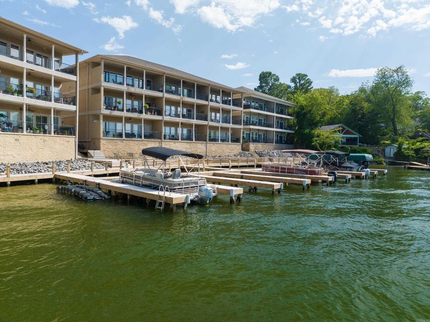 Perfect for Full Time Lake Living, or as a Short Term Rental Investment Property! This Gorgeous Lakefront Ground Level Condo is Selling Fully Furnished! Located in the Highly Desirable 7 South Area! Offering 2 King Ensuites, Big Water Views, Beautiful & Comfortable Furnishings, a Fully Stocked Kitchen, Coffee Bar, Large Dining Table that Comfortably seats 6 and a Covered Patio to Enjoy the Lakefront Views! The Primary Bedroom Features an Ensuite with a Custom Tile Walk-In Shower and a Large Walk-In Closet. It also has Private Access to the Lakeside Patio featuring Big Water Views. The Secondary Bedroom is situated on the Front of the Unit off of the Kitchen and just steps from the Guest Bathroom. There is One Assigned Parking Space (directly in front of the unit) and Visitor Parking is Steps Away! Experience Lake Living in this Immaculate Condo and Enjoy the Boardwalk along the Waterfront and Pool Amenities!